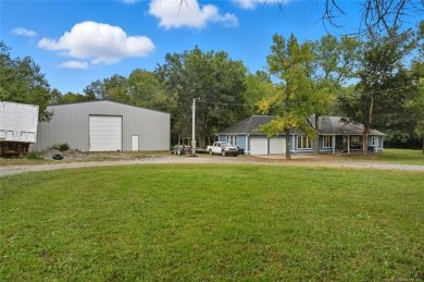 Tucked away on 16 peaceful wooded acres, this cozy 3-bedroom