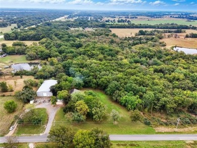 Tucked away on 16 peaceful wooded acres, this cozy 3-bedroom