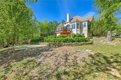 Set on a premier lakefront lot along the shores of Table Rock - photo 4