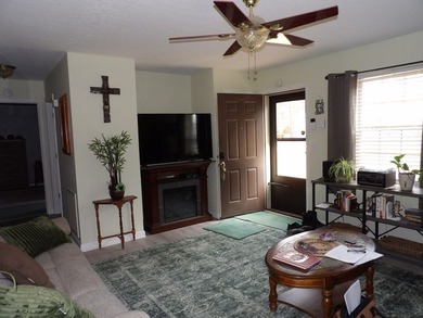 Well-maintained property featuring a 14' RV carport with hookups - photo 2