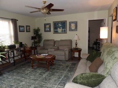 Well-maintained property featuring a 14' RV carport with hookups - photo 4