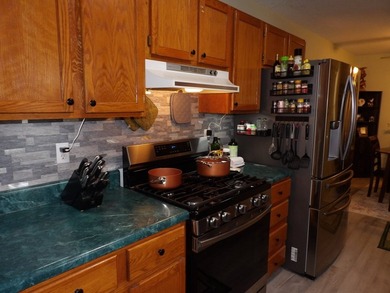 Well-maintained property featuring a 14' RV carport with hookups - photo 9
