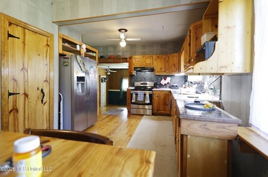 Country home nestled on 4.48 acres, features a pond and ample - photo 9