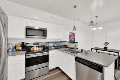 Step into this sleek, main-floor condo located in one of Utah's - photo 7