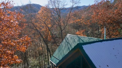 Escape to this beautifully crafted 2BR/2.5BA, 2.5-story cabin