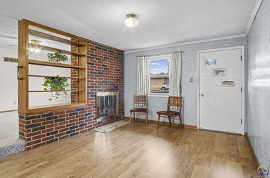 Welcome to this charming ranch-style residence that perfectly