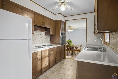 Welcome to this charming ranch-style residence that perfectly