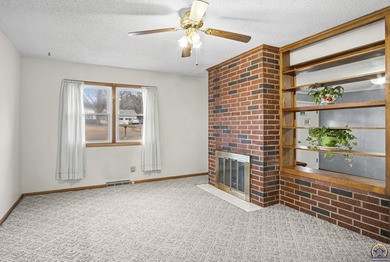 Welcome to this charming ranch-style residence that perfectly