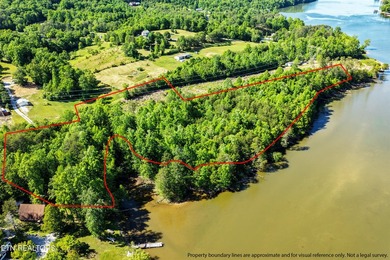 Sitting on the Tennessee River, this 8/4 +- acre tract, gently - photo 1
