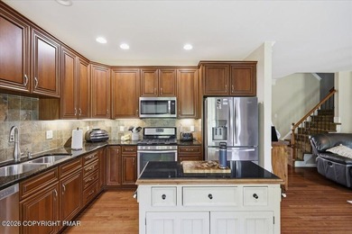 This pristine 3-bedroom, 2.5-bath townhome showcases an - photo 9