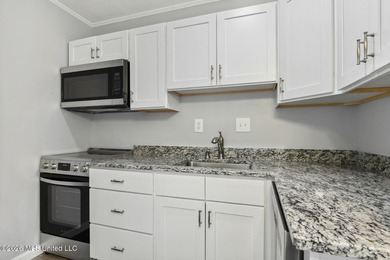 Discover effortless living in Diamondhead with this easy-care - photo 5