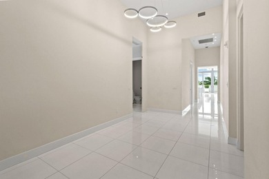 Step through the lobby level entry into ceilings that hold at - photo 2