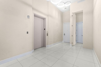 Step through the lobby level entry into ceilings that hold at - photo 3