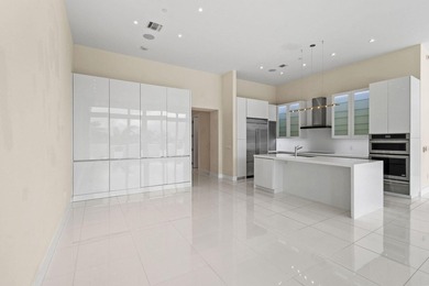 Step through the lobby level entry into ceilings that hold at - photo 5