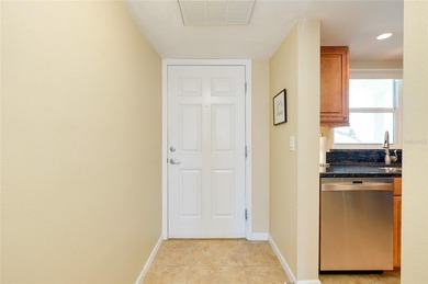 This beautifully updated second-floor unit showcases quality