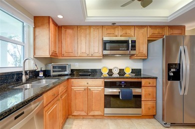 This beautifully updated second-floor unit showcases quality