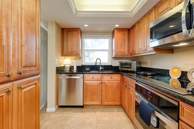 This beautifully updated second-floor unit showcases quality