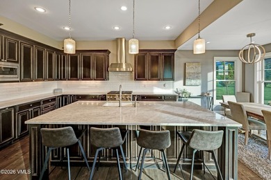 Welcome home to the coveted Eagle Ranch community, where - photo 12