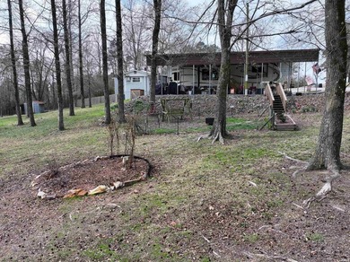 Conveniently located near Lake Greeson and area ATV trails, this - photo 42