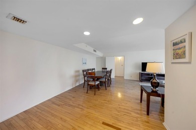 Brand-new floor-to-ceiling impact windows enhance this bright - photo 5