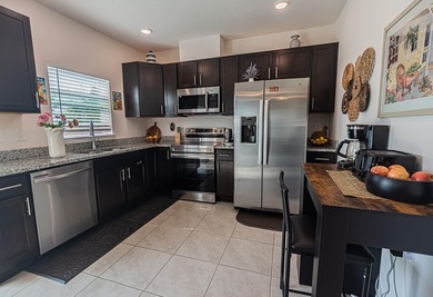 Built in 2023, this 3/2/2 CBS home perfectly combines modern - photo 6