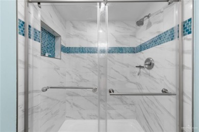 This beautifully remodeled, turn-key 2-bed/2-bath condo at Padre