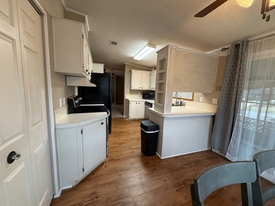 This updated home has a 2018 roof, upgraded windows, upgraded - photo 8