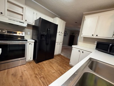 This updated home has a 2018 roof, upgraded windows, upgraded - photo 10