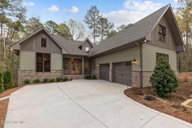 Nestled on a quiet cul-de-sac in Forest Creek Golf Club, this - photo 1