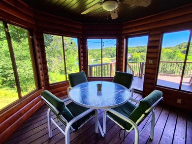 Tucked into a quiet bay with 152 feet of waterfront, this - photo 13