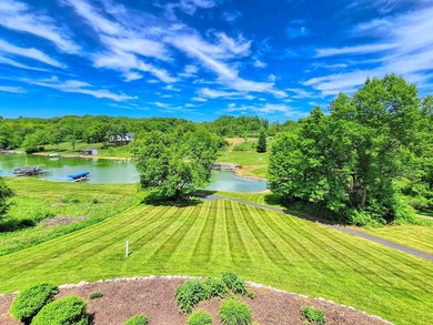 Tucked into a quiet bay with 152 feet of waterfront, this - photo 17