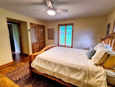 Tucked into a quiet bay with 152 feet of waterfront, this - photo 19
