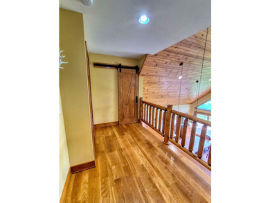 Tucked into a quiet bay with 152 feet of waterfront, this - photo 21
