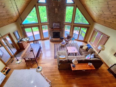 Tucked into a quiet bay with 152 feet of waterfront, this - photo 22