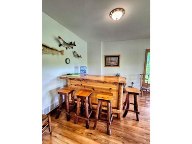 Tucked into a quiet bay with 152 feet of waterfront, this - photo 30