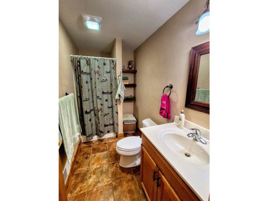 Tucked into a quiet bay with 152 feet of waterfront, this - photo 32