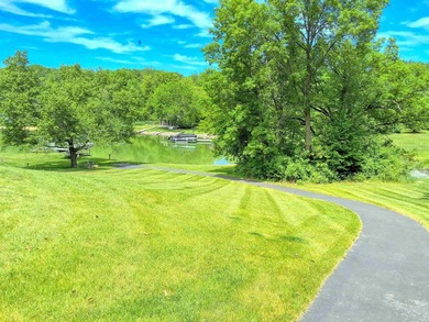 Tucked into a quiet bay with 152 feet of waterfront, this - photo 37