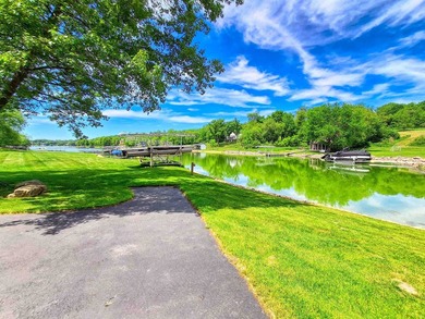Tucked into a quiet bay with 152 feet of waterfront, this - photo 38