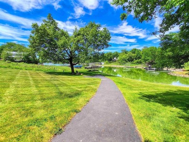Tucked into a quiet bay with 152 feet of waterfront, this - photo 40