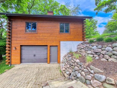 Tucked into a quiet bay with 152 feet of waterfront, this - photo 42