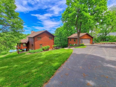 Tucked into a quiet bay with 152 feet of waterfront, this - photo 44