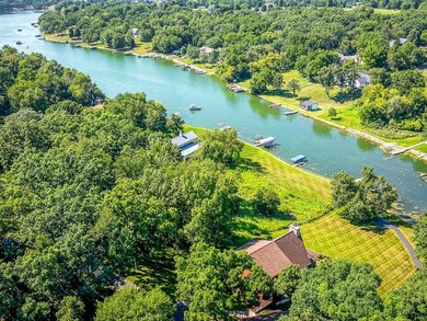 Tucked into a quiet bay with 152 feet of waterfront, this - photo 45