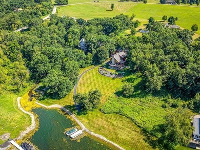 Tucked into a quiet bay with 152 feet of waterfront, this - photo 46