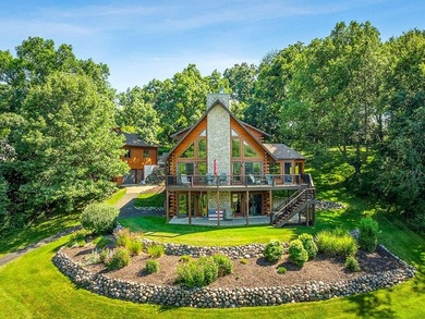 Tucked into a quiet bay with 152 feet of waterfront, this - photo 47