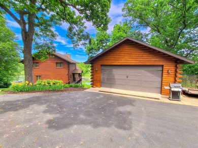 Tucked into a quiet bay with 152 feet of waterfront, this - photo 48