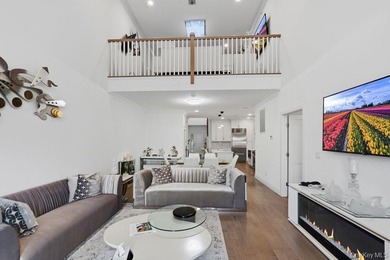 A Fabulous Jamestown Townhouse has a dramatic 2 Story Grand - photo 18
