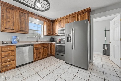 This spacious 4-bedroom, 2 bath home with a bonus room situated - photo 7