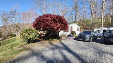 Charming 3-bedroom, 2-bath home located less than  mile up Caney