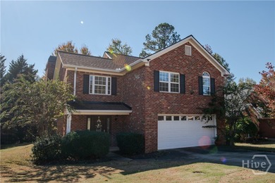 Charming and low-maintenance, this all-brick two-story home is - photo 1