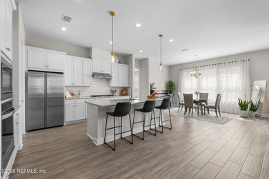 THIS HOME FEELS BRAND NEW! Located on a rare .38-acre fully - photo 4